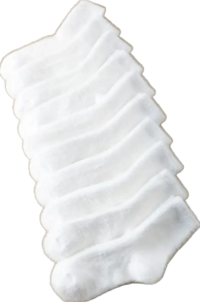 Set of six white ankle socks stacked on a white background